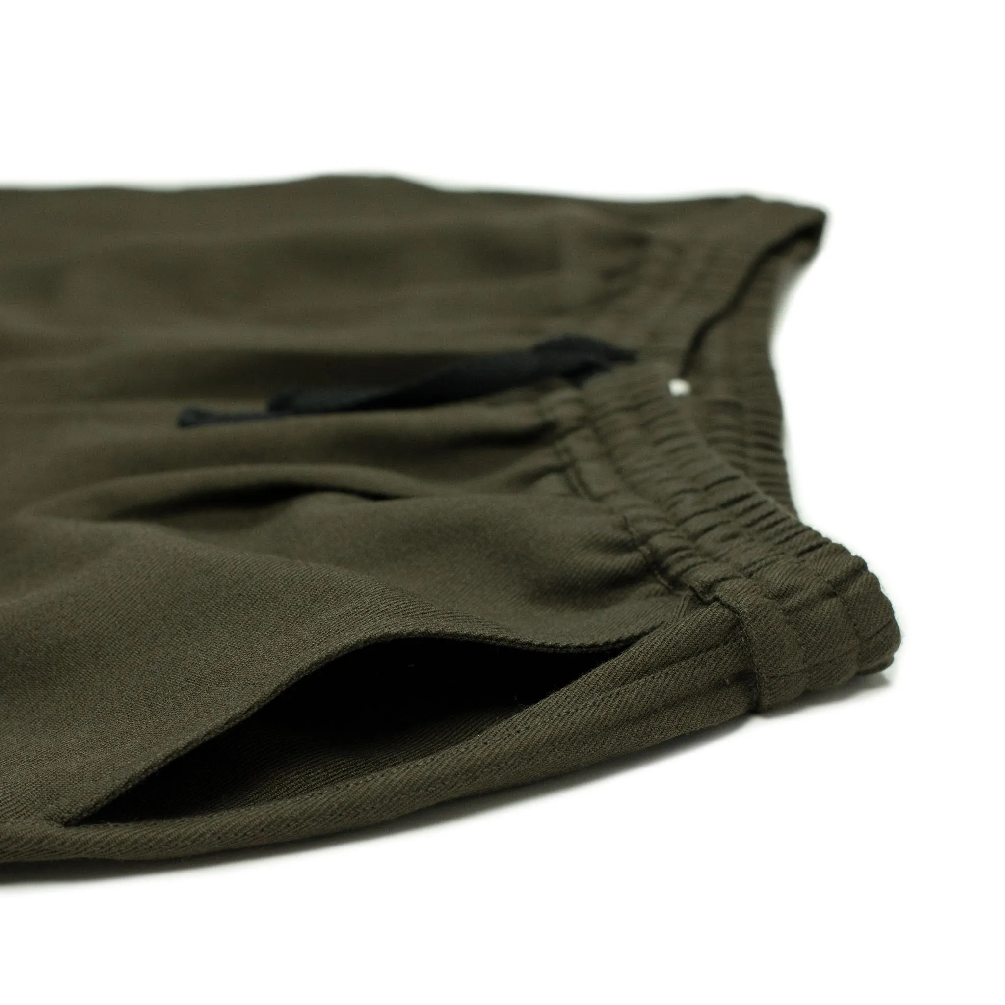 Drawstring trousers in forest green wool gabardine