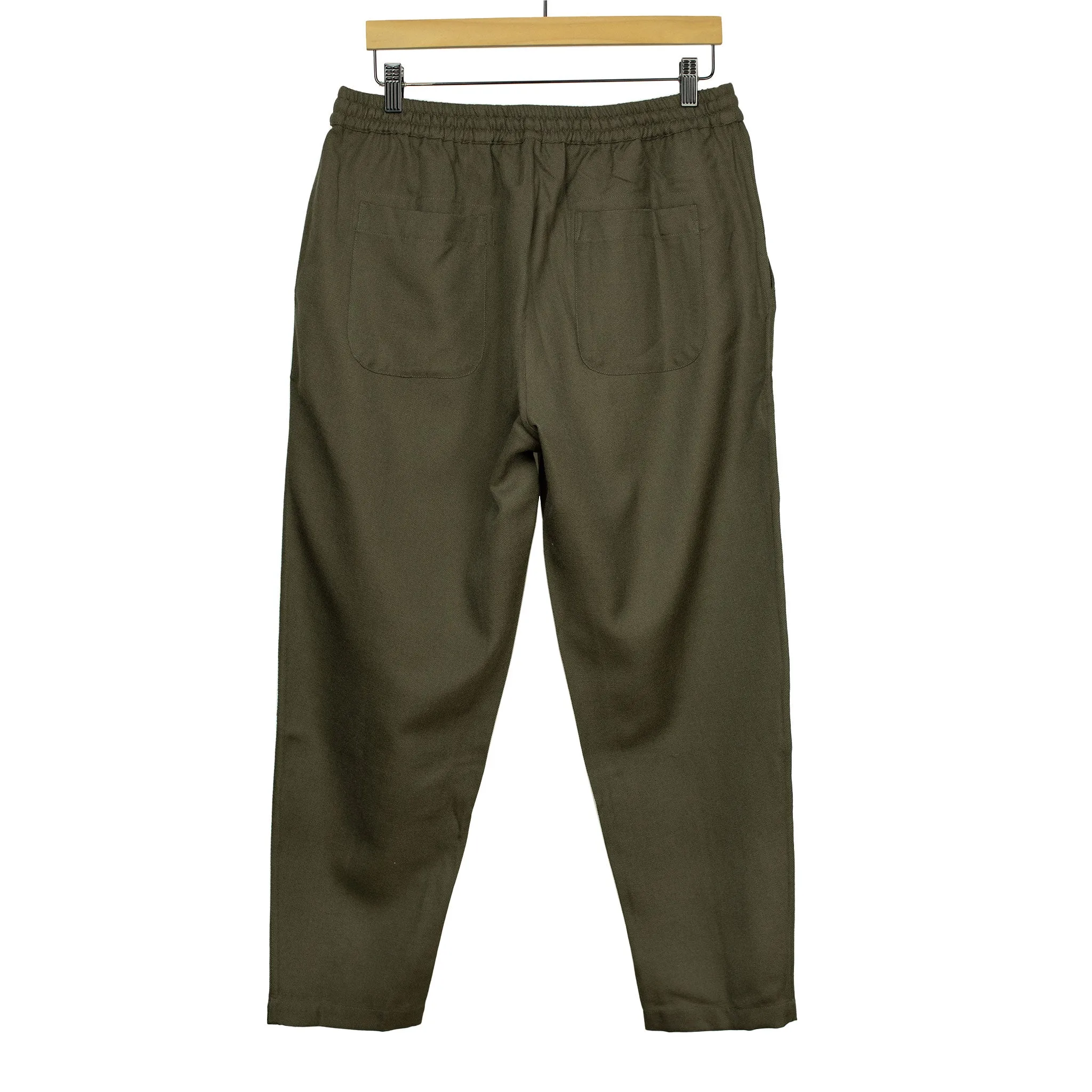 Drawstring trousers in forest green wool gabardine