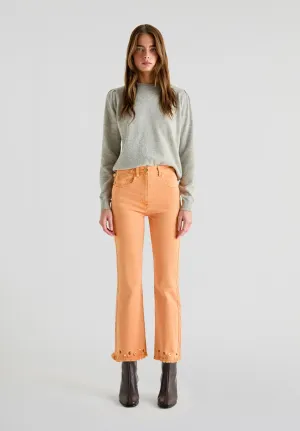 FLARED JEANS WITH STUDS ON THE HEMS